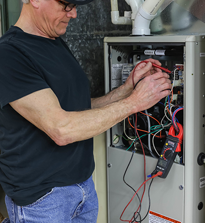 Furnace Repair in Ocean County Technician at work
